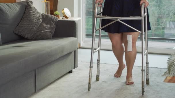 Woman Home Walking Walker Knee Surgery — Stock Video