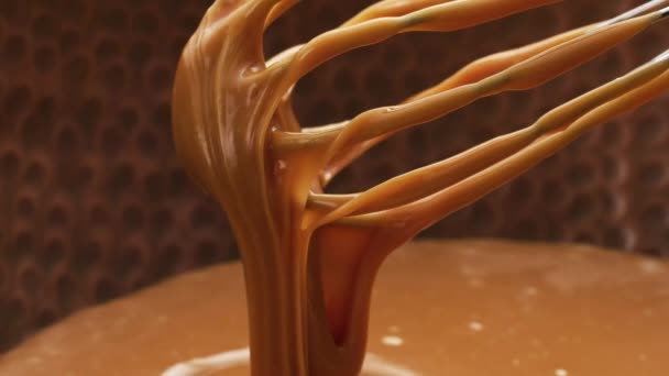 Melted Caramel Dripping Whisk Closeup Food Shot — Stock Video