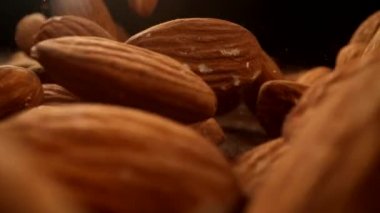 Bademler ağır çekimde ahşap yüzeye düşüyor. Phantom Flex 4K kamera ile çekildi..