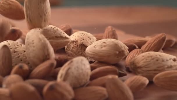 Almonds Falling Wooden Surface Super Slow Motion Shot Phantom Flex — Stock Video