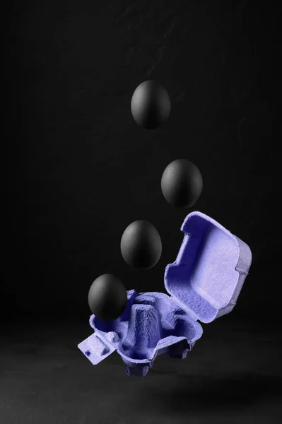 Floating Air Black Painted Eggs Container Dark Background Easter Creative — Stock Photo, Image