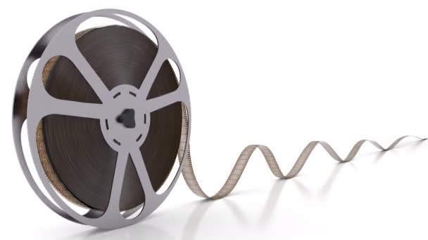 Spinning film spoel met film haspel geïsoleerd op de lege witte achtergrond — Stockvideo