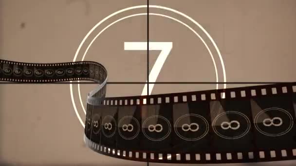 Animated film rolling against retro countdown movie for filmmaking introduction — Stock Video