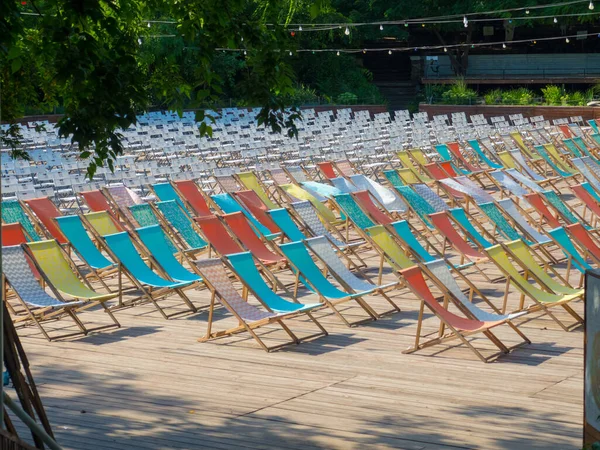 Rows of chairs in an open air theatre of a public park