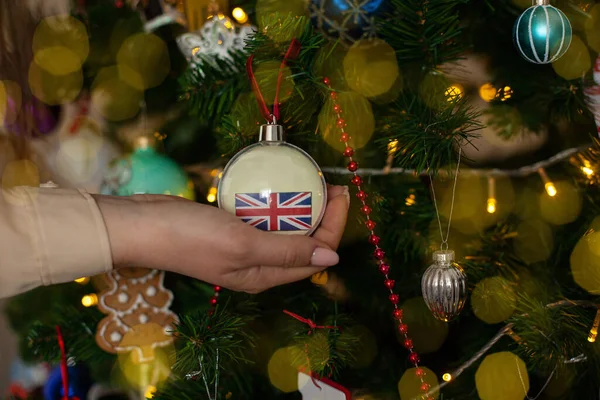 Close Girls Hand Holding Christmas Ball Fir Tree Flag Great — Stockfoto