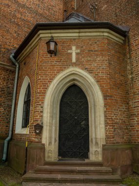 The door in The Roman Catholic church of St. Bartholomew, Drohobych, Ukraine. Medieval iron door of Church 15-16th Century, gothic, baroque architecture.