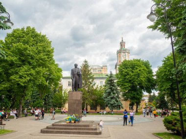 Sambir, Ukraine - May, 2022: Town Hall of Sambir on Market square was built in 1638-1668 and reconstructed in 1844. Taras Shevchenko monument in front of the Town hall