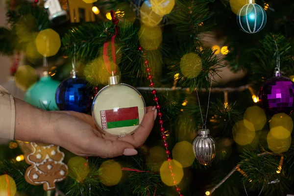 Close Girls Hand Holding Christmas Ball Fir Tree Flag Belarus — Stockfoto