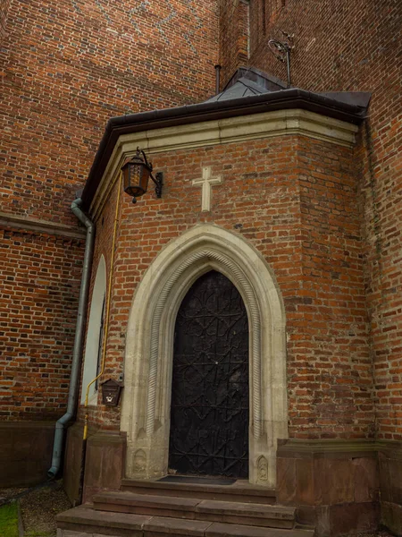 The door in The Roman Catholic church of St. Bartholomew, Drohobych, Ukraine. Medieval iron door of Church 15-16th Century, gothic, baroque architecture.