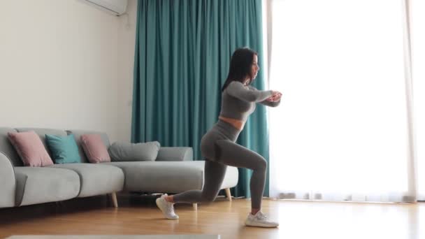 Female butt workout squats at home. Fitness at home concept — Wideo stockowe