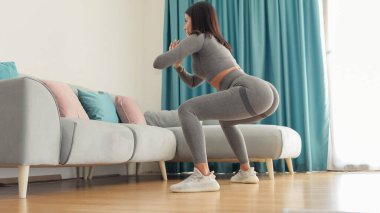female butt workout squats at home. Fitness at home concept