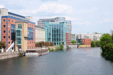 Berlin, Germany, May 10, 2022, view over the river Spree to the ensemble of buildings in Moabiter Spreebogen with Abion Hotel