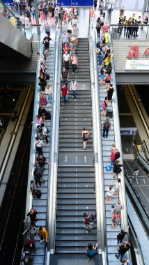 Berlin, Germany, July 5, 2022, escalators in the central station with many travelers