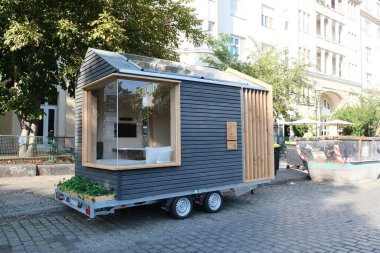 Berlin, Germany, July 29, 2022, parked, very small Tinyhouse at Paul Lincke Ufer.