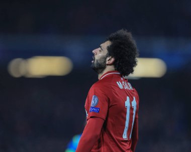 11 Aralık 2018 'de, Anfield, Liverpool, İngiltere; UEFA Şampiyonlar Ligi, Liverpool v Napoli; Liverpool' dan Muhammed Salah (11), Liverpool 'dan ateşli atışıyla hayal kırıklığı dolu bir bakış attı.