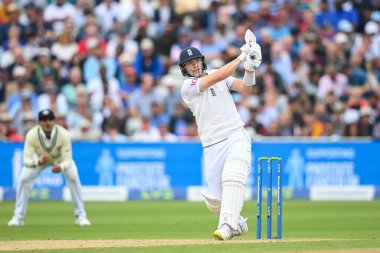 Matthew Potts of England hits a six (6)