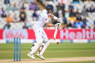 Joe Root of England cuts the ball away fine to the boundary