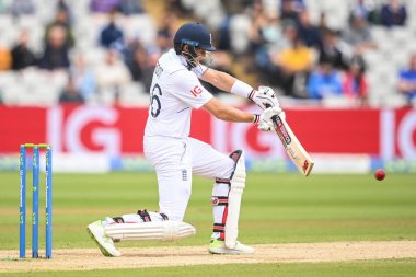 Joe Root of England hits at shot but is fielded by Hanuma Vihari of India