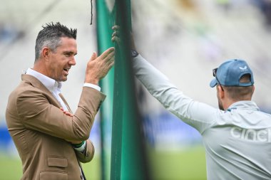 Former England player Kevin Pietersen chats to Brendon McCullum head coach of England during pre game warm up