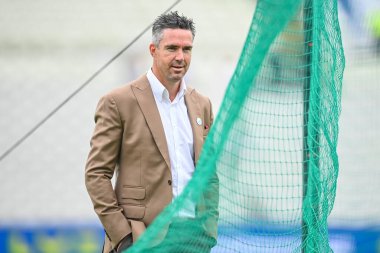 Former England player Kevin Pietersen watches Joe Root of England during batting warm up before the game