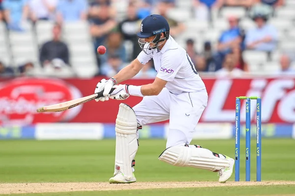 Joe Root of England plays a scoop shot for a six (6)