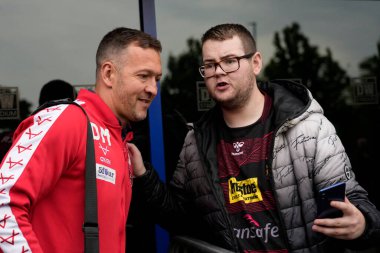 Danny McGuire Head Coach of Hull KR poses for a selfie with a fan before the game 