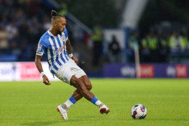 Sorba Thomas #7 of Huddersfield Town passes the ball 