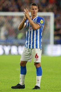 Jonathan Hogg #6 of Huddersfield Town applauds the fans at the final whistle 
