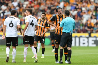 Jacob Greaves #4 of Hull City is spoken to by the referee 