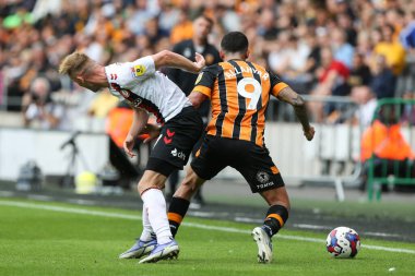 Allahyar Sayyadmanesh #9 of Hull City and Mark Sykes #17 of Bristol City tussle for the ball 