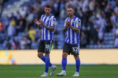 Marvin Johnson #18 of Sheffield Wednesday and Jack Hunt #32 of Sheffield Wednesday applaud the fans after the game