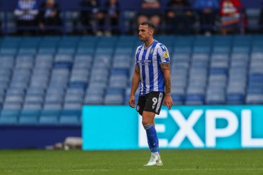 Lee Gregory #9 of Sheffield Wednesday walks off the pitch after being sent off