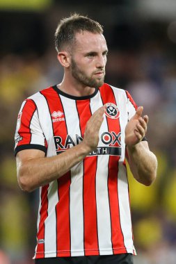 Rhys Norrington-Davies #33 of Sheffield United claps the travelling fans 