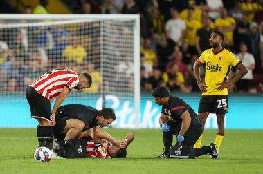 John Egan #12 of Sheffield United receives treatment from the physio