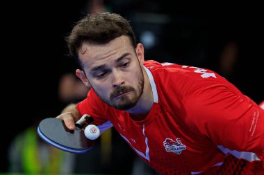 Sam Walker of England serves to Callum Evans of Wales