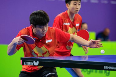 Izaac Quek of Singapore serves to Shaun Jones of South Africa