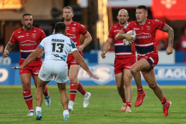 Shaun Kenny-Dowall #4 of Hull KR runs at Anthony Marion #13 of Toulouse Olympique 
