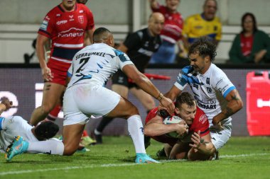 Frankie Halton #27 of Hull KR goes over for a try to make it 14-16