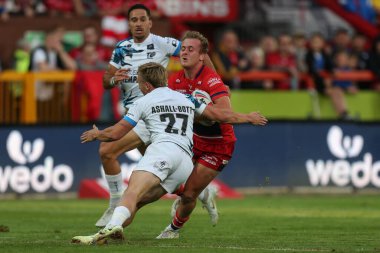 Jez Litten #14 of Hull KR runs at Olly Ashall-Bott #27 of Toulouse Olympique