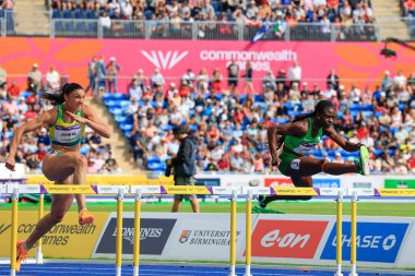 Tobi Amusan of Nigeria leads from Michelle Jenneke of Australia in the heats of the Womens 100m hurdle 