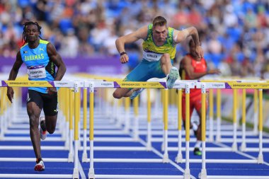 Cedric Dubler of Australia on his way to winning the Decathlon 100m hurdles