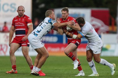 Rowan Milnes #21 of Hull KR runs at the Toulouse defence