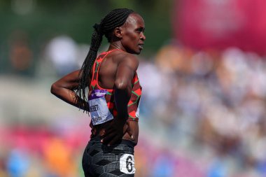 Winny Chebet of Kenya looks to the scoreboard for her result in the heat of the womens 1500m  