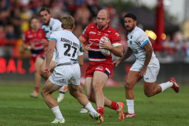 George King #10 of Hull KR runs at Olly Ashall-Bott #27 of Toulouse Olympique