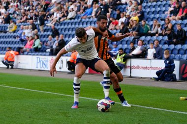 Allahyar Sayyadmanesh #9 of Hull City competes for the ball with Jordan Storey #14 of Preston North End