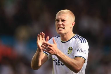 Rasmus Kristensen of Leeds United celebrates the win and applauds the fans at the end of the game