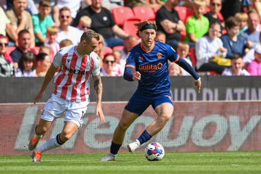 Josh Bowler #11 of Blackpool makes a break with the ball