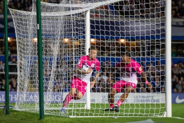 Danny Ward #25 of Huddersfield Town celebrates his goal and rushes back with the ball during the second half  