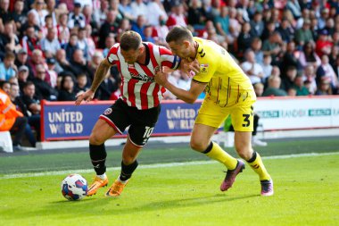 Billy Sharp #10 of Sheffield United and Murray Wallace #3 of Millwall
