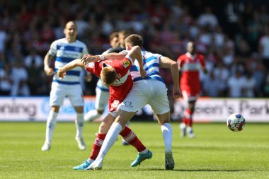 Duncan Watmore #18 of Middlesbrough and Jimmy Dunne #3 of QPR tussle for the ball 